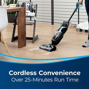 CrossWave Cordless Cleaning Hard Flooring in Work Room. Text: Cordless Convenience Over 25-Minutes Run Time